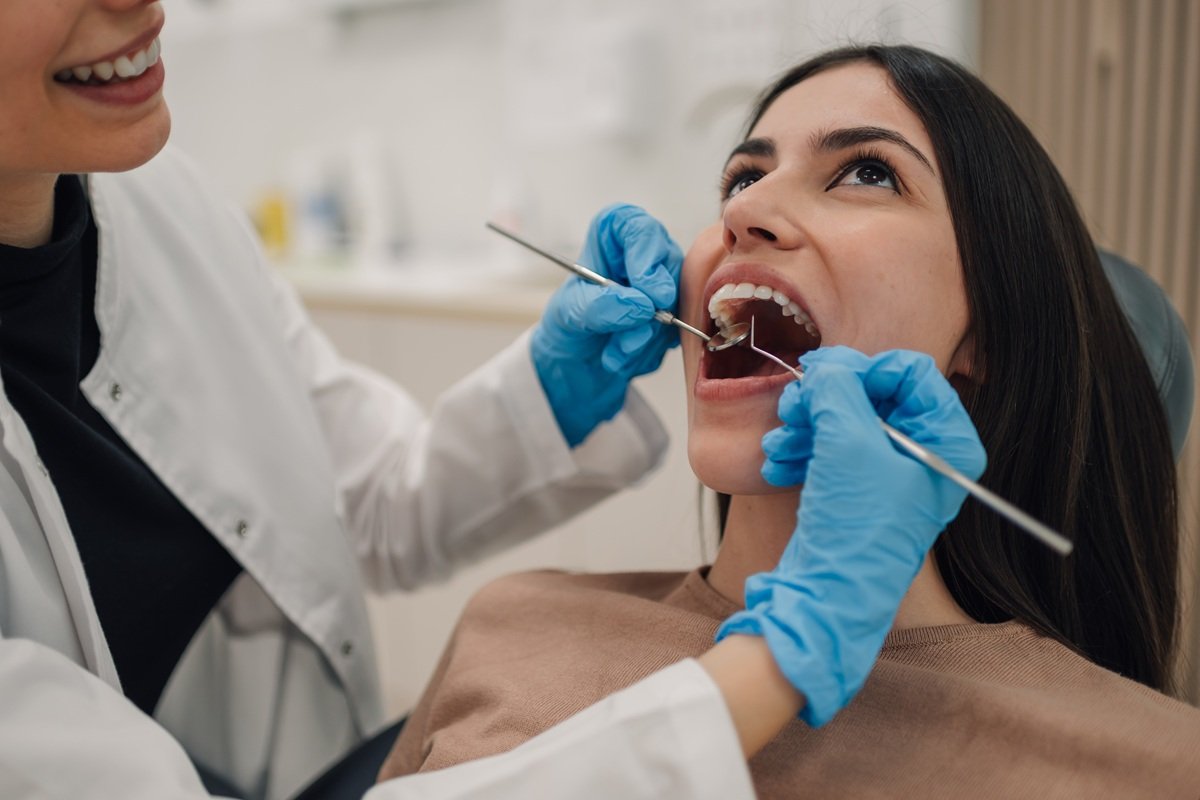 dentist-examining-patient-s-teeth-with-dental-tool-2026-03-25-09-39-04-utc.jpg