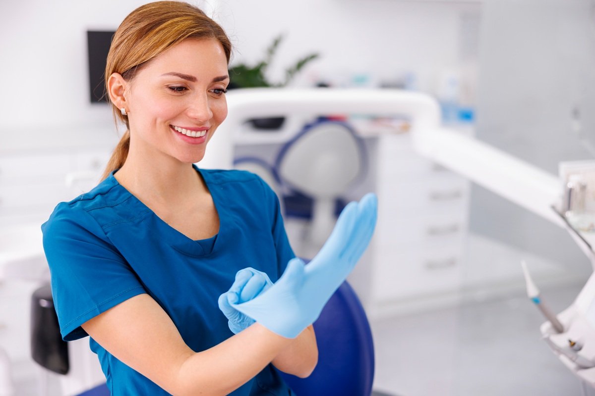 smiling-woman-doctor-puts-on-sterile-gloves-2026-03-24-04-47-40-utc.jpg